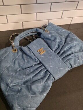 Denim Quilted Bow-Front Shoulder Bag with Gold Hardware